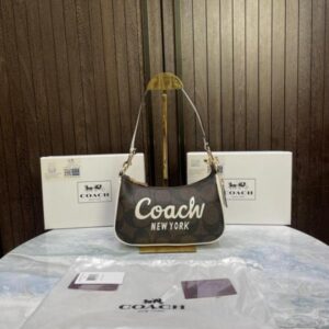 Coac_h teri mini crossbody bag in signature canvas with Coac_h graphic & original box 731